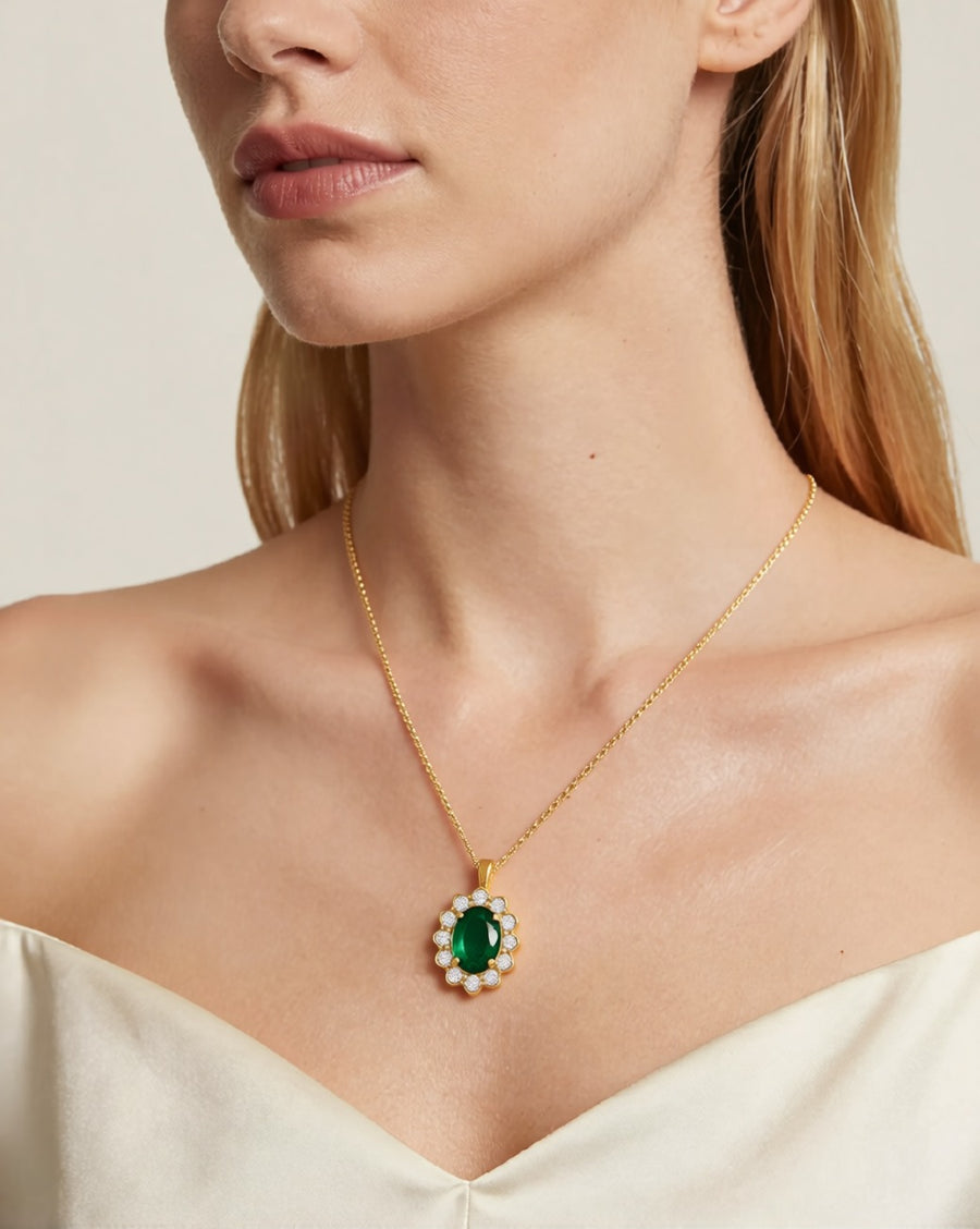 BOSCONA gold necklace with emerald-green oval pendant worn by model