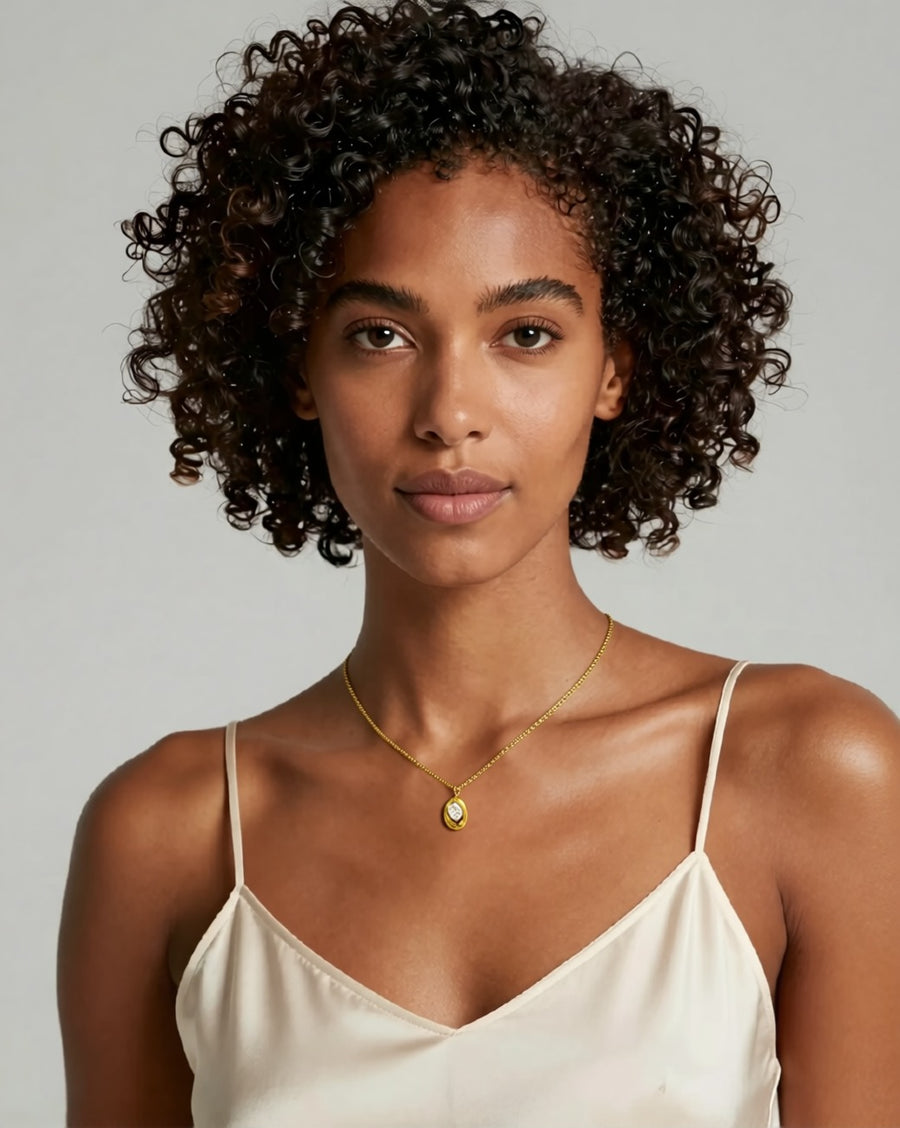 BOSCONA gold oval zircon pendant necklace worn by model