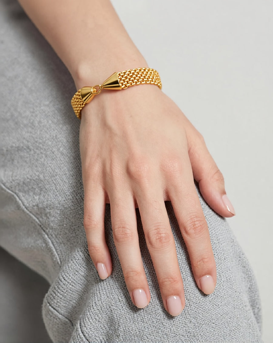 BOSCONA wide gold mesh band bracelet worn on wrist
